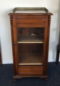 An Edwardian mahogany single door music cabinet wi