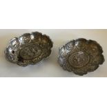 A good pair of silver bonbon dishes decorated with