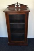 An Edwardian mahogany glazed music cabinet with sh