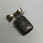 A good hinged top silver vesta case with bow top.