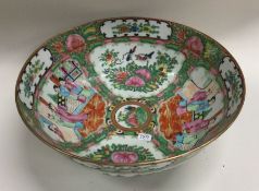 A Chinese Canton fruit bowl decorated in bright co