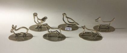 A good set of six silver menu holders in the form