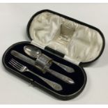 A heavy cased silver three piece christening set.