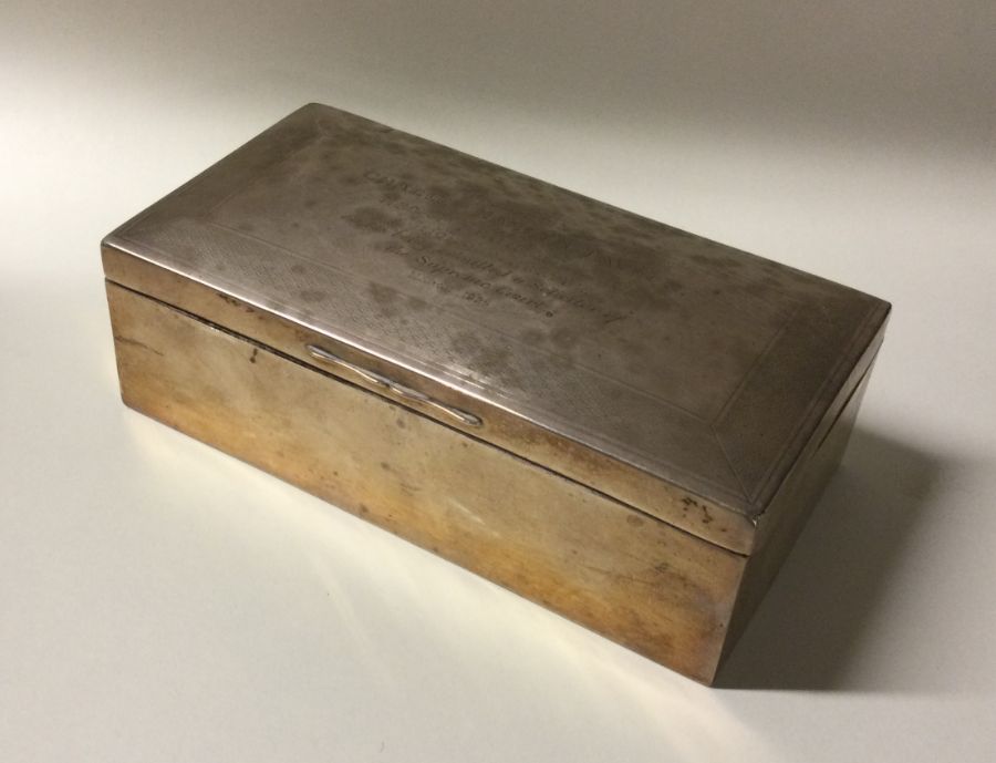 An Edwardian silver cigarette box with dome top. A