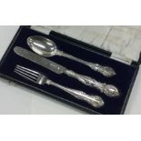 A heavy cased silver three piece christening set.