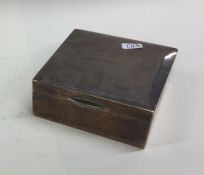 An Edwardian silver cigarette box with engine turn