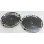 A good pair of Georgian silver salvers of circular