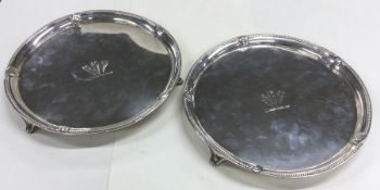 A good pair of Georgian silver salvers of circular