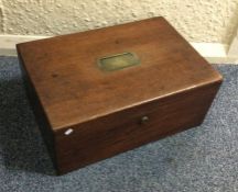 A Georgian mahogany hinged top box with brass hand