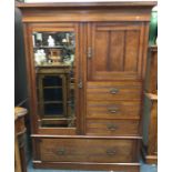 A mahogany compactum wardrobe. Est. £50 - £80.