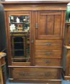 A mahogany compactum wardrobe. Est. £50 - £80.