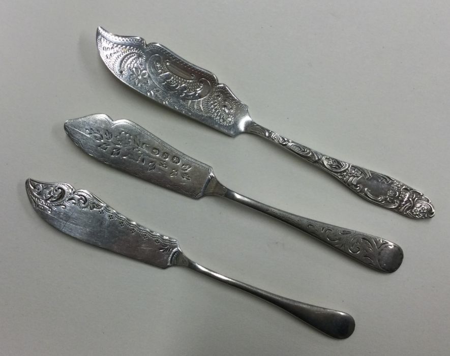 A group of three attractively engraved butter kniv