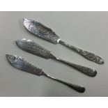 A group of three attractively engraved butter kniv