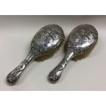 A good pair of silver mounted hairbrushes decorate