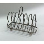 An Edwardian silver seven bar toast rack with loop