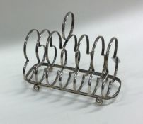 An Edwardian silver seven bar toast rack with loop