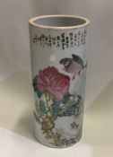 A large tall Chinese vase decorated with flowers a
