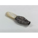 A small silver and MOP rattle. Approx. 23 grams. E