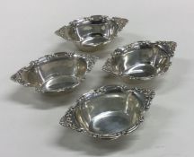 A heavy set of four American silver bonbon dishes