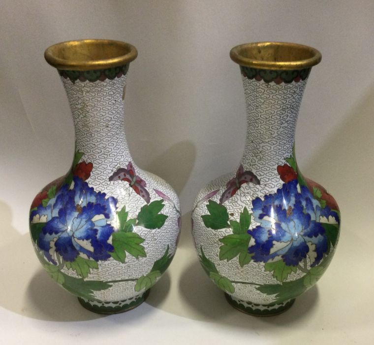 A pair of Chinese cloisonné vases decorated in bri