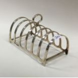 An Edwardian silver toast rack of typical form. Bi