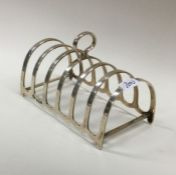 An Edwardian silver toast rack of typical form. Bi