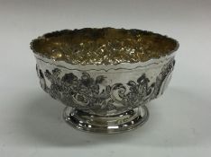 A heavy chased silver sugar bowl with crested armo