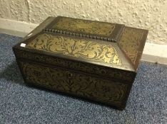 A Regency rosewood inlaid caddy. Est. £120 - £150.