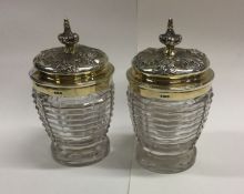 An attractive pair of cut glass preserve jars with