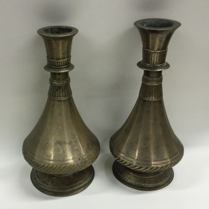 A pair of unusual Antique tapering brass vases of
