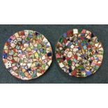 A pair of unusual pottery mosaic plates of circula