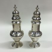 A rare pair of Georgian silver sugar casters. Lond