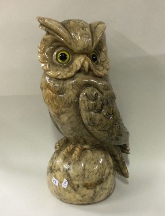 A large hardstone figure of an owl in seated posit