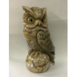 A large hardstone figure of an owl in seated posit