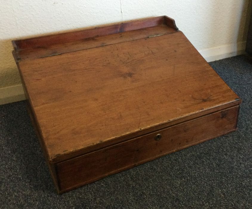 An old mahogany slope top box. Est. £15 - £20.
