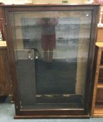 A good glazed single door gun cabinet. Est. £50 -