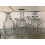 A group of three glass decanters. Est. £10 - £20.