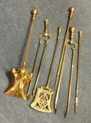 Two good brass companion sets. Est. £30 - £50.