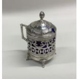A Continental silver hinged top mustard pot with s