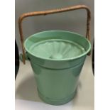 A retro green cane handled mop bucket. Est. £20 -