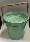 A retro green cane handled mop bucket. Est. £20 -