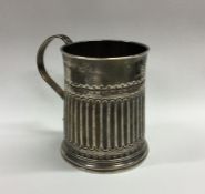 A good George III crested silver half fluted mug o