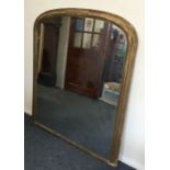 A large gilt over mantle mirror. Est. £40 - £60.
