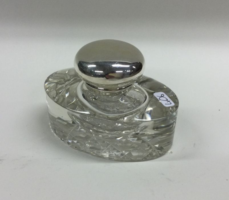 An attractive oval glass and silver mounted inkwel