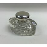 An attractive oval glass and silver mounted inkwel