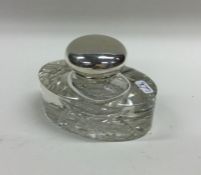 An attractive oval glass and silver mounted inkwel