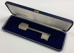 A heavy cased silver commemorative 'Coming of Age