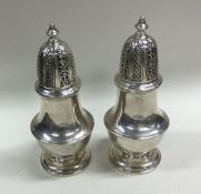 A good pair of Georgian style silver sugar casters