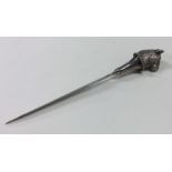A cast silver plated letter opener of typical form