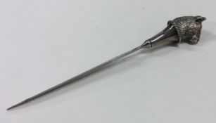 A cast silver plated letter opener of typical form